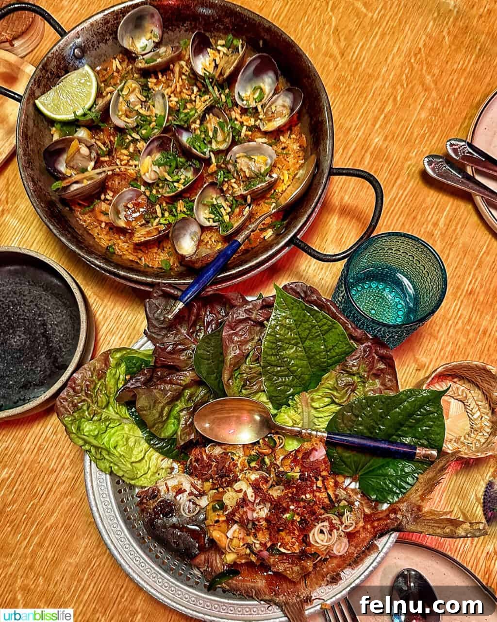 Portland's Top Romantic Dinner Spots 37 Delectable Thai Paella and a whole fried fish on a wooden table at Phuket Cafe.