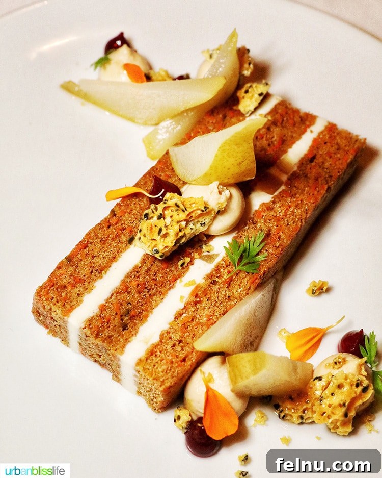 Portland's Top Romantic Dinner Spots 51 Moist carrot cake with colorful garnishes on a white plate at RingSide Steak House in Portland, Oregon.