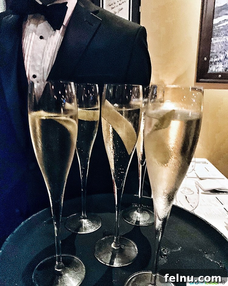 Portland's Top Romantic Dinner Spots 52 Elegant champagne glasses on a tray held by a waiter at RingSide Steak House.