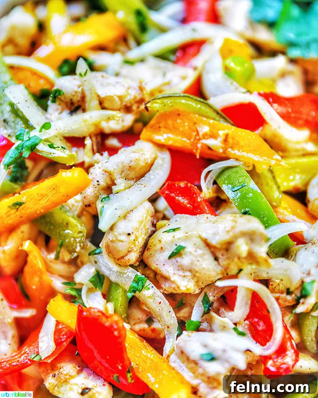 Sizzling Sheet Pan Chicken Fajitas 3 A close-up shot highlighting the sizzling Sheet Pan Chicken Fajitas, showcasing the perfectly cooked chicken and vibrant vegetables.