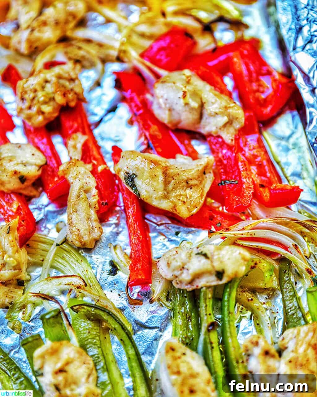 Sizzling Sheet Pan Chicken Fajitas 4 A top-down view of freshly cooked Sheet Pan Chicken Fajitas, emphasizing the even cooking of the chicken and peppers, ready to be served.