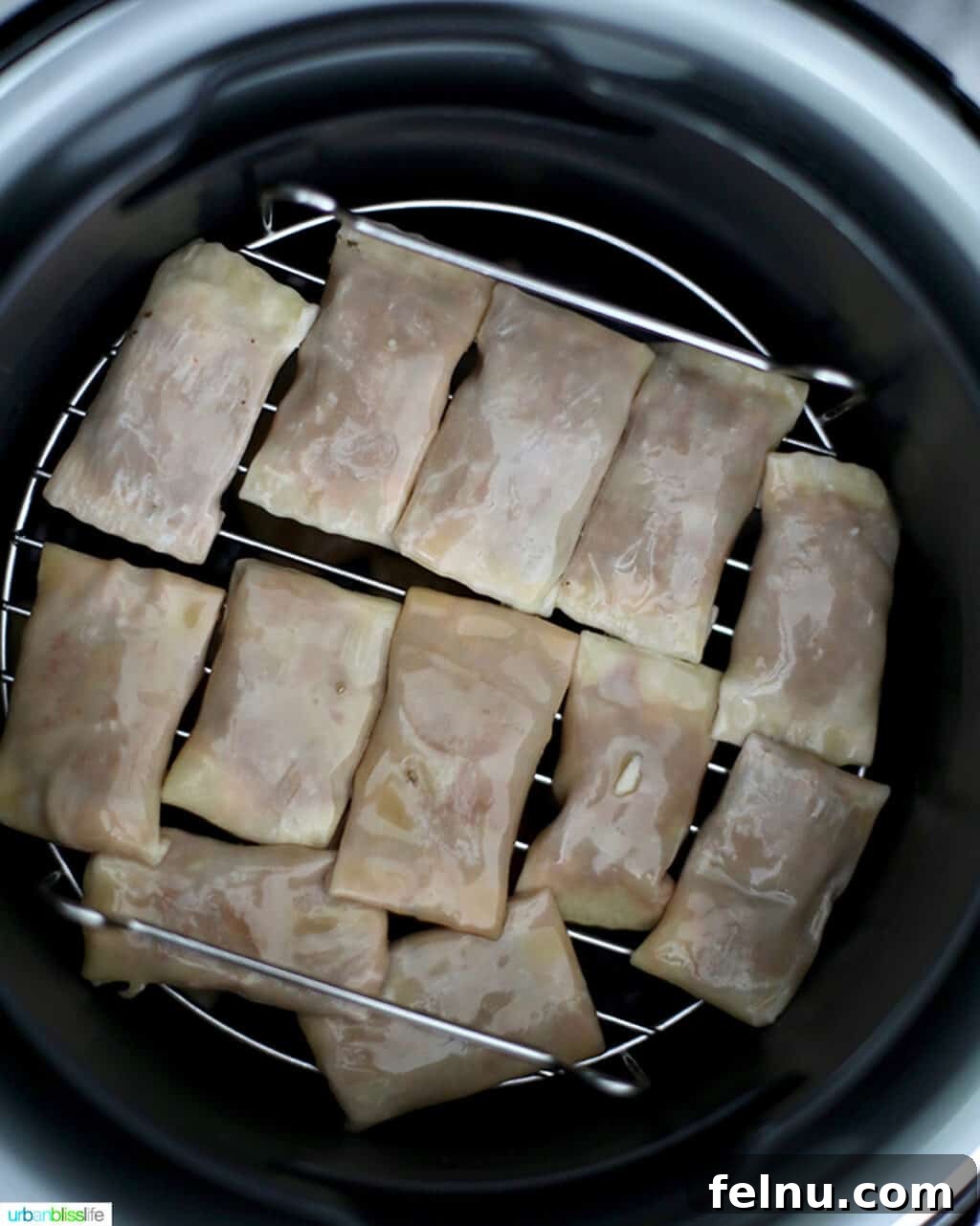 Crispy Air Fryer Pizza Rolls 15 pizza rolls inside an air fryer