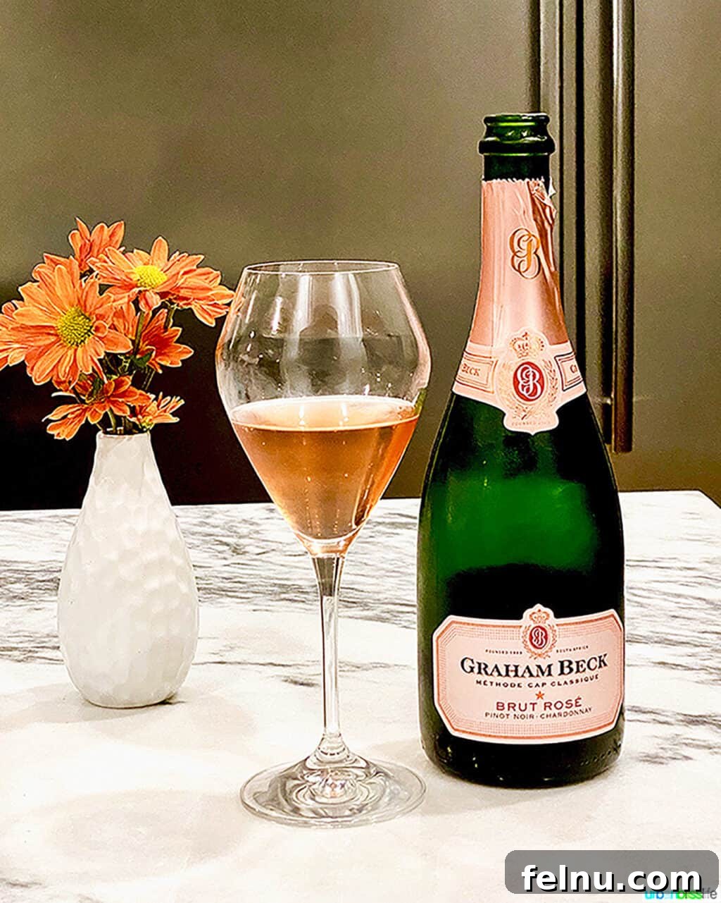 Perfect Wines for Valentines Day 8 graham beck brut rose bottle, glass, and flowers