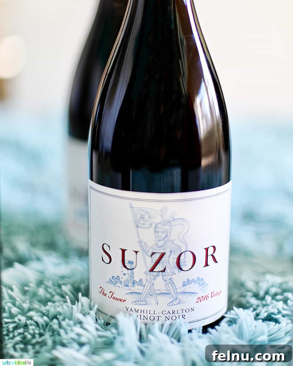 Top Oregon Pinot Noir Picks for Your Next Dinner Party 5 Bottle of Suzor Oregon Pinot Noir on a soft blue blanket