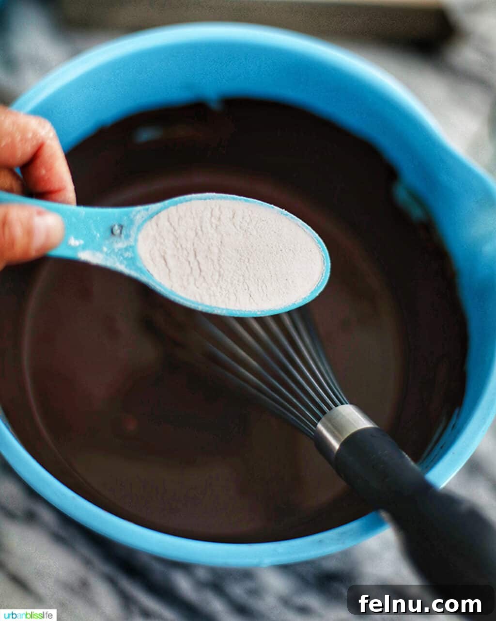 Mint Chocolate Decadence Brownies 6 Pouring flour into brownie mixture