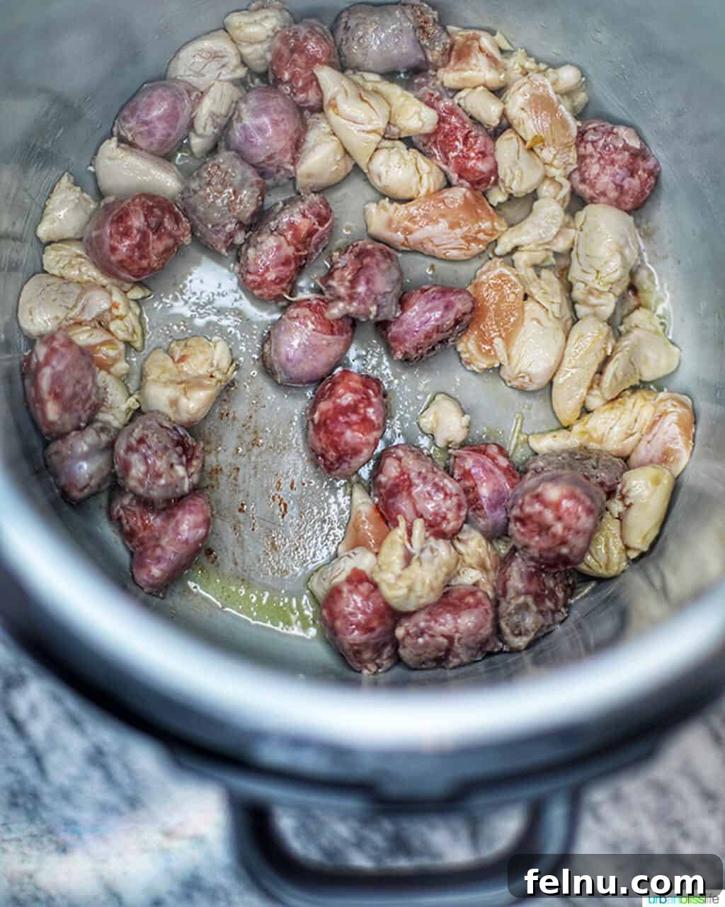Cajun Chicken Pasta in a Flash 6 Sausage and chicken sautéing in the Ninja Foodi