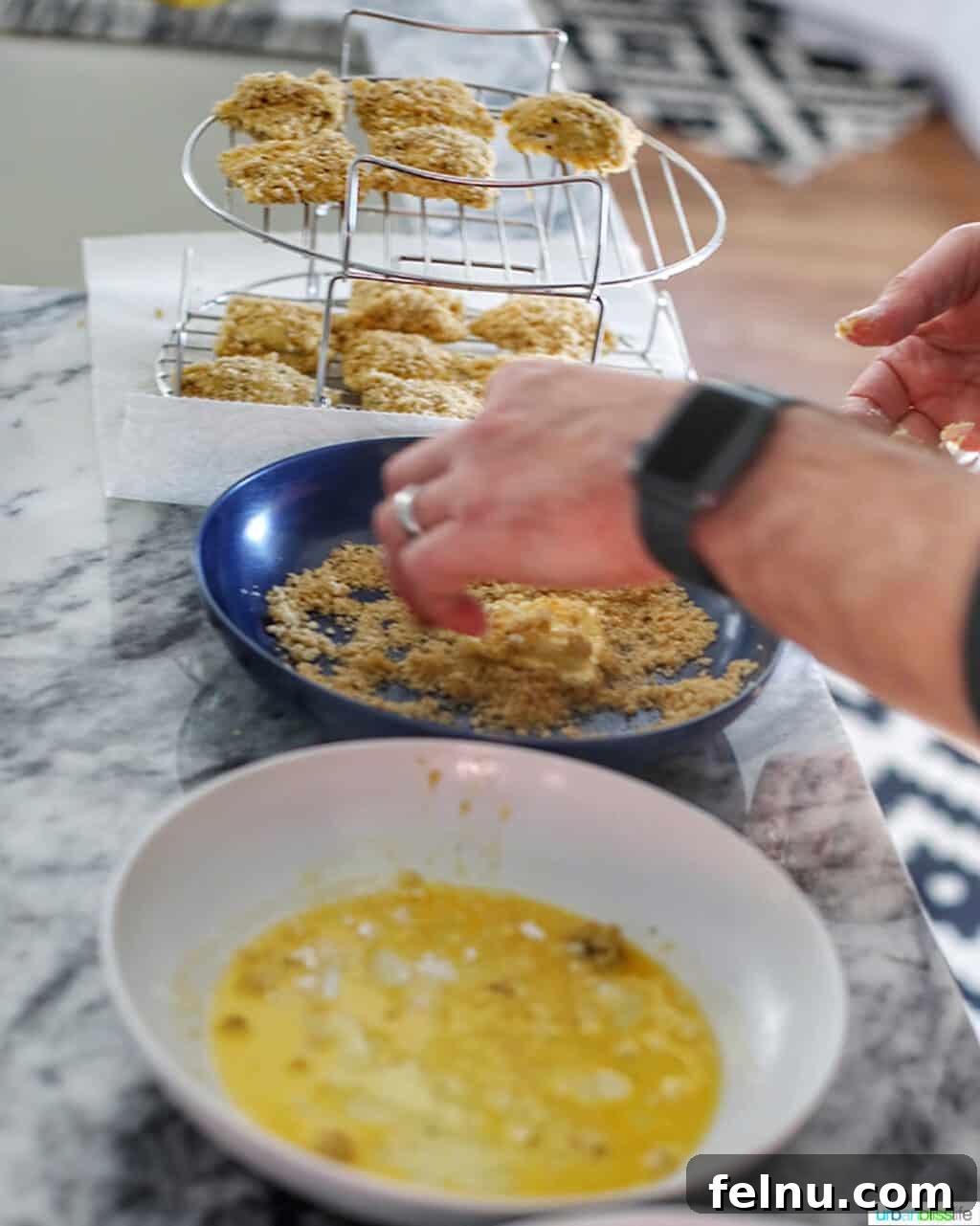 Air Fryer Ravioli Bites 4 Preparing the ravioli breading station with flour, egg wash, and breadcrumbs.
