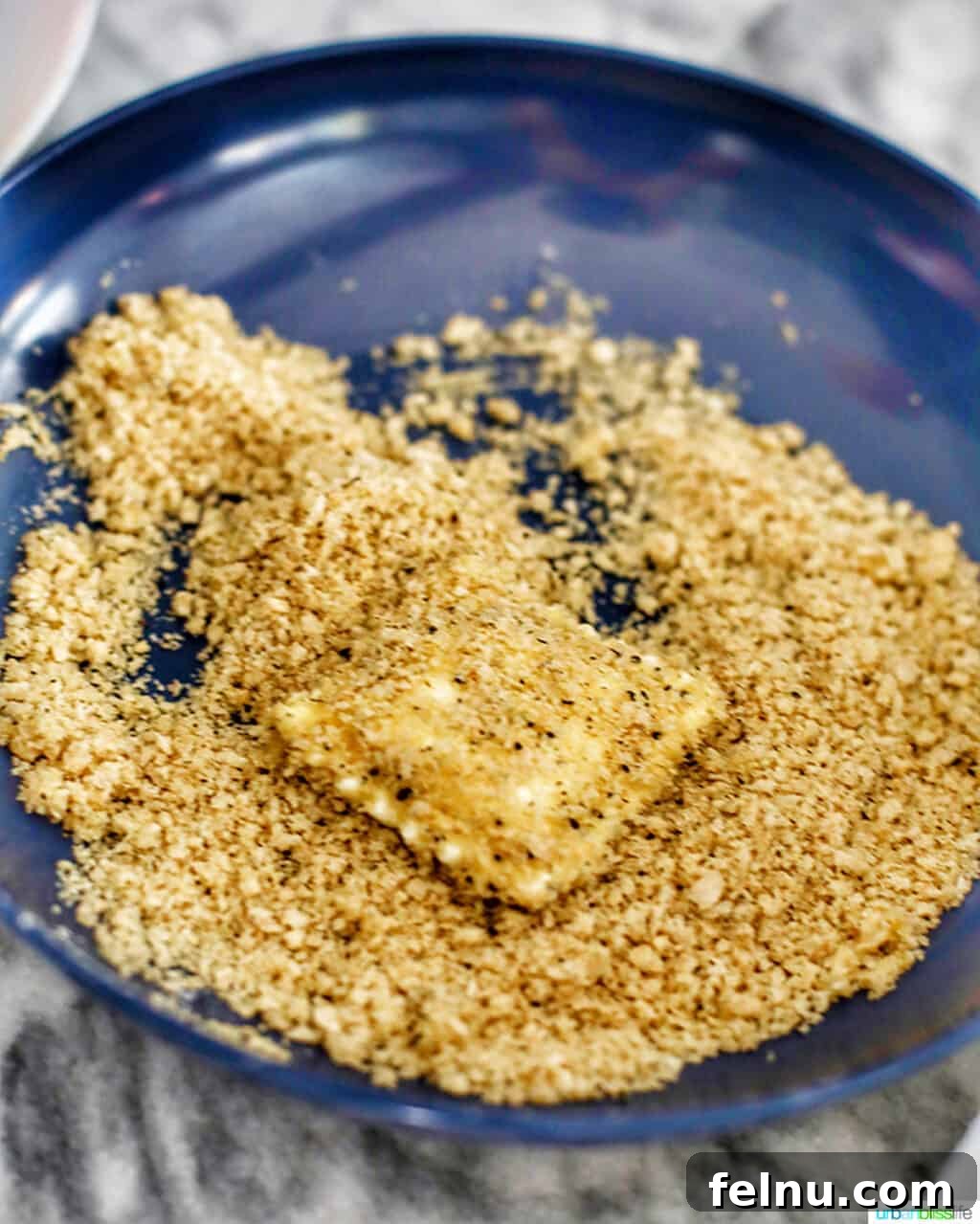 Air Fryer Ravioli Bites 5 Coating the ravioli with panko breadcrumbs for a crispy texture.