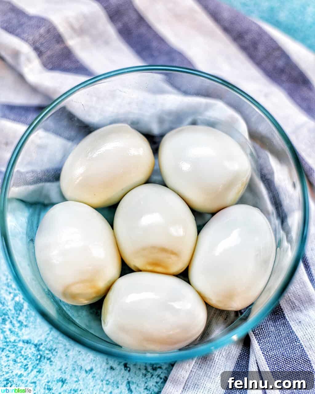 Perfect Hard Boiled Eggs with Ninja Foodi 2 Ninja Foodi Hard Boiled Eggs in a bowl, perfectly cooked and ready to eat