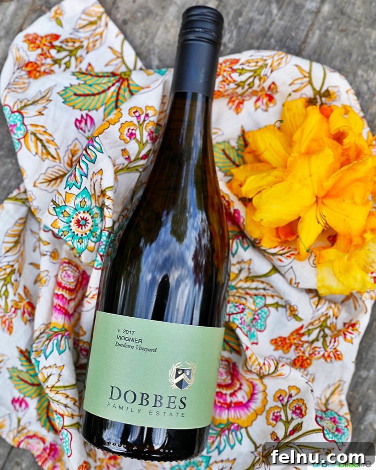 Easy Instant Pot Salsa Chicken 8 bottle of Dobbes Winery Viognier with colorful napkin and flowers