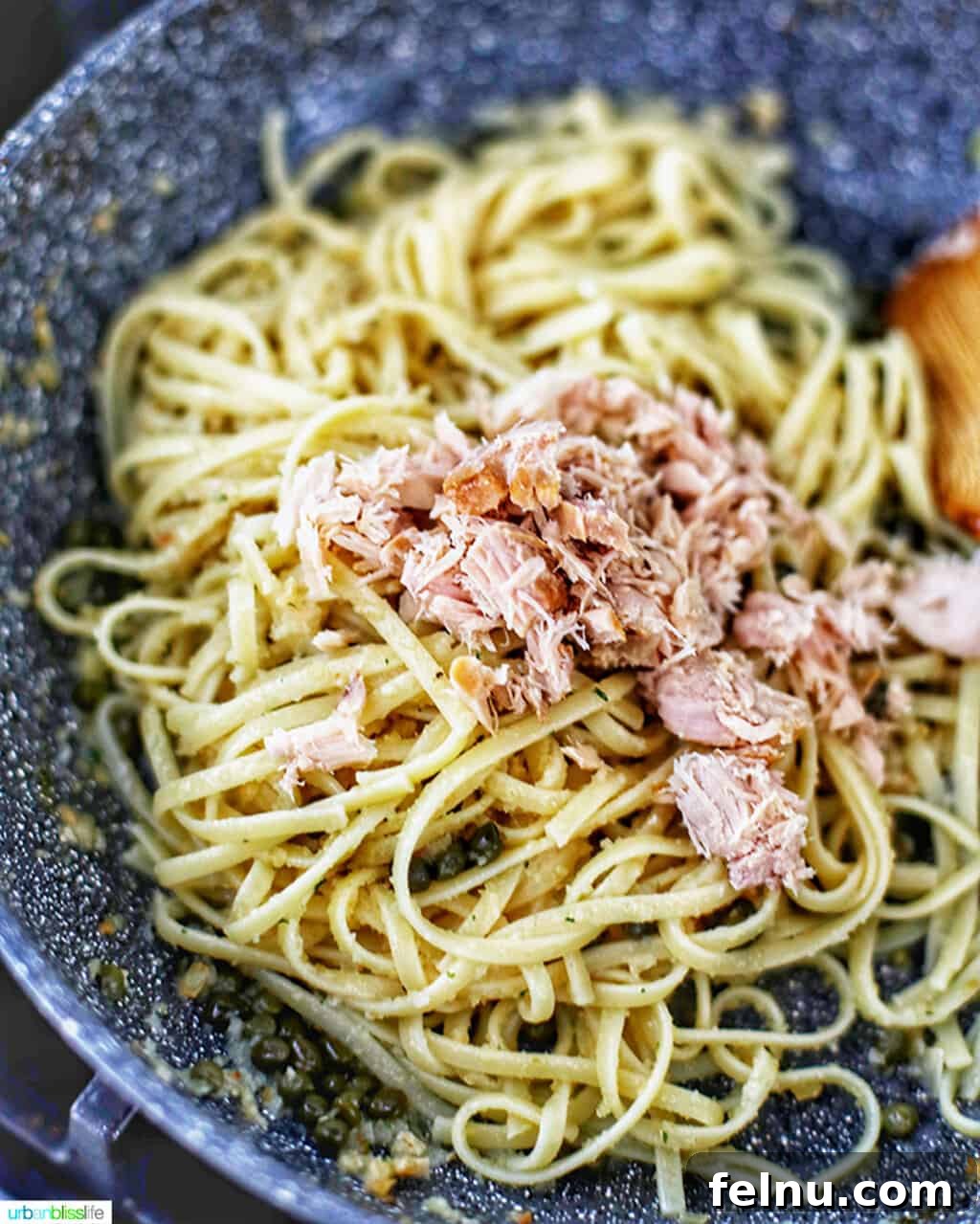 Tuna Pasta in Creamy Caper White Wine Sauce 8 Adding tuna to pasta in skillet