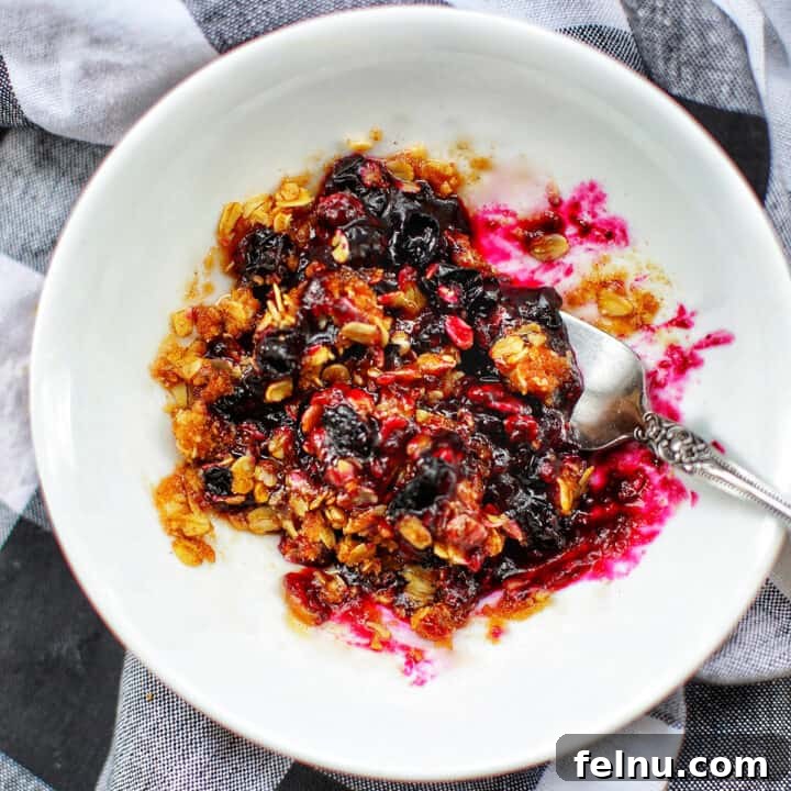 Blueberry crisp on a white plate