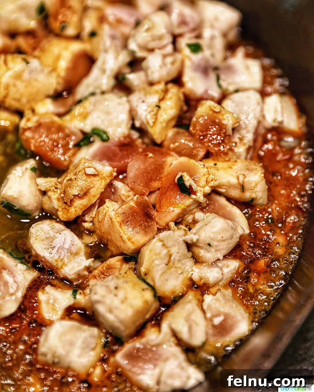 Golden Garlic Butter Chicken Morsels 6 Chicken cooking in a pan until golden