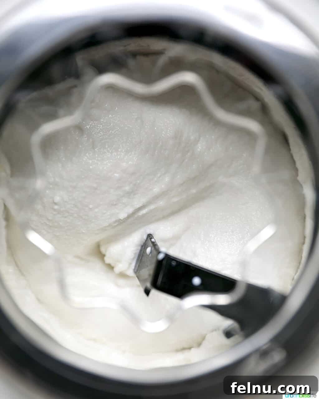 Decadent Dairy-Free Chocolate Chip Delight 5 Dairy-free ice cream base churning in an ice cream maker, pre-chocolate addition.