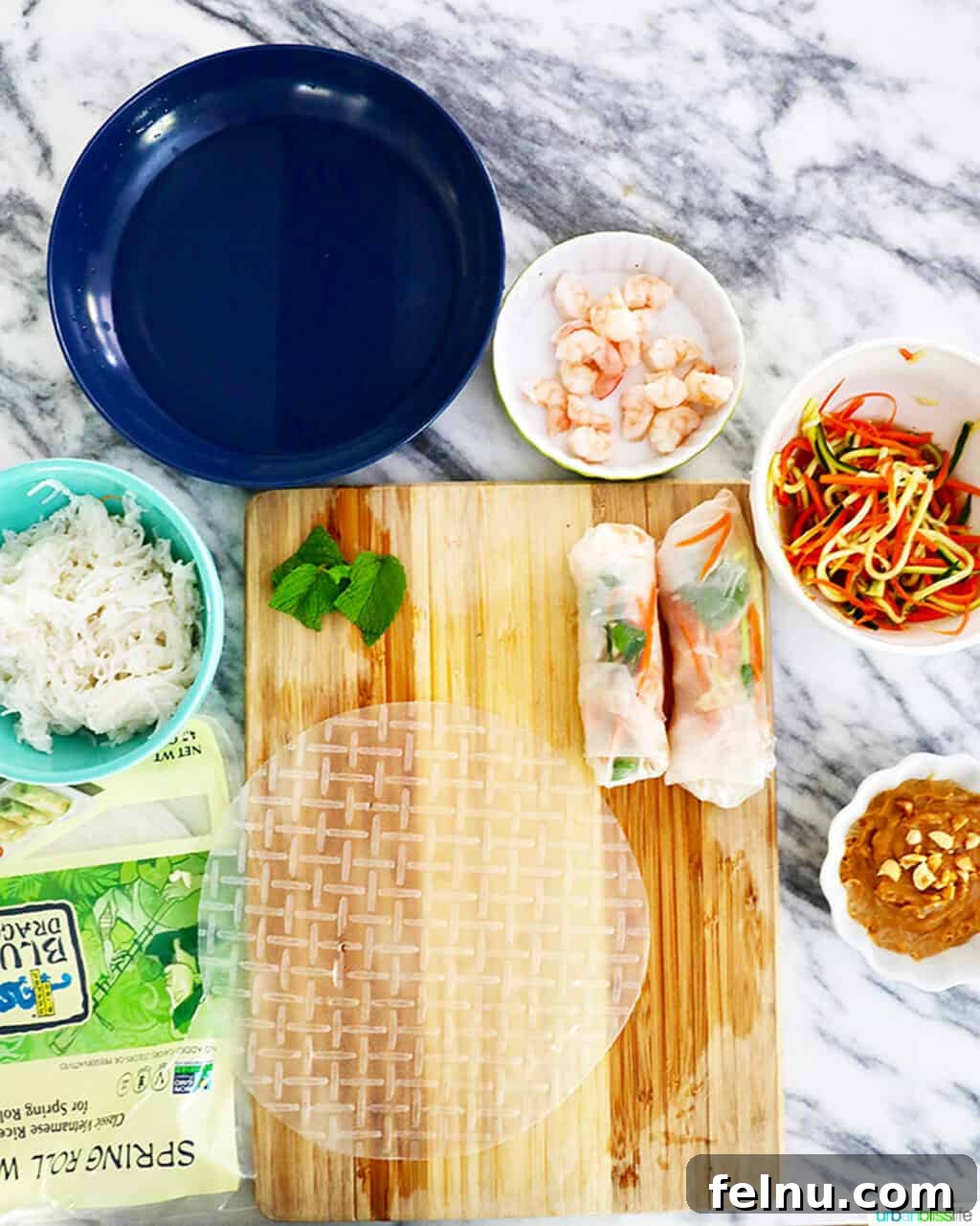 Steps to assembling shrimp summer rolls, showing the placement of ingredients.