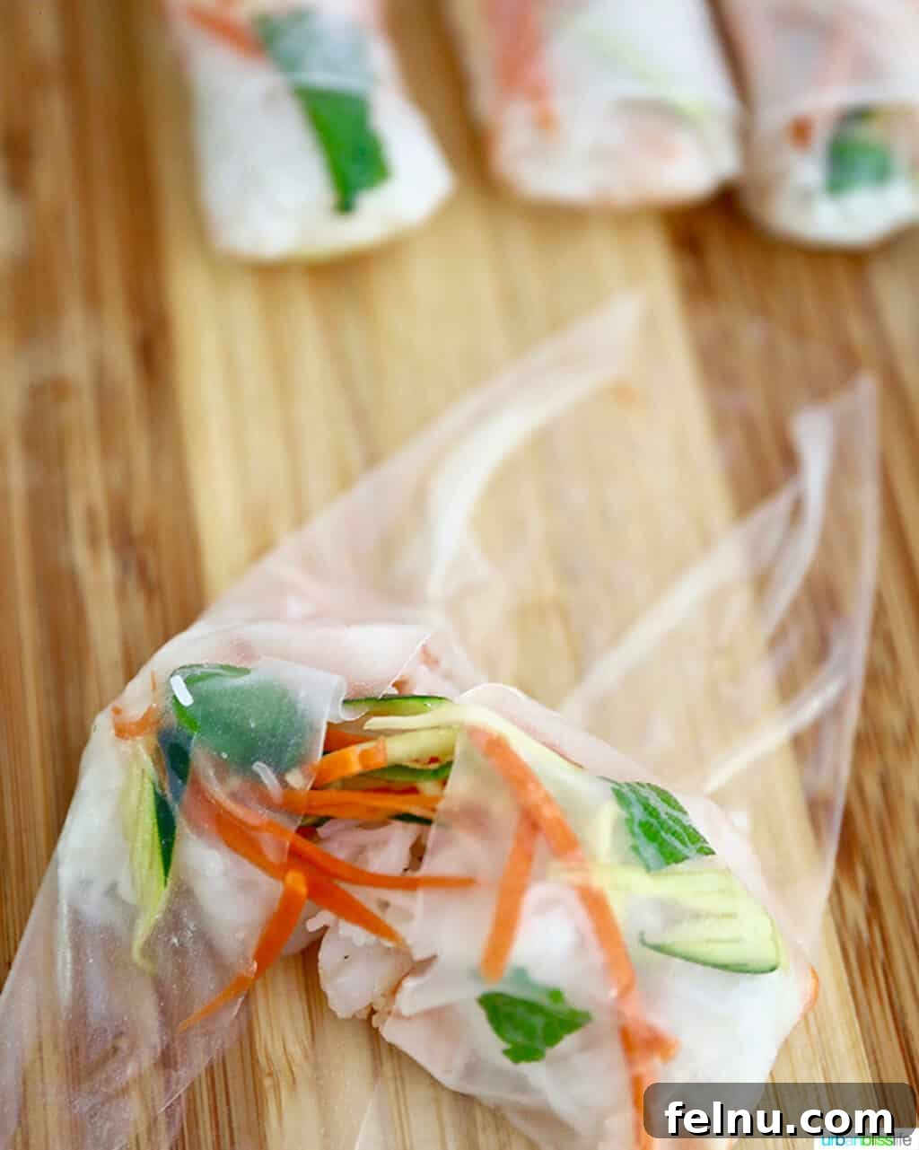 Demonstration of folding the shrimp summer rolls.