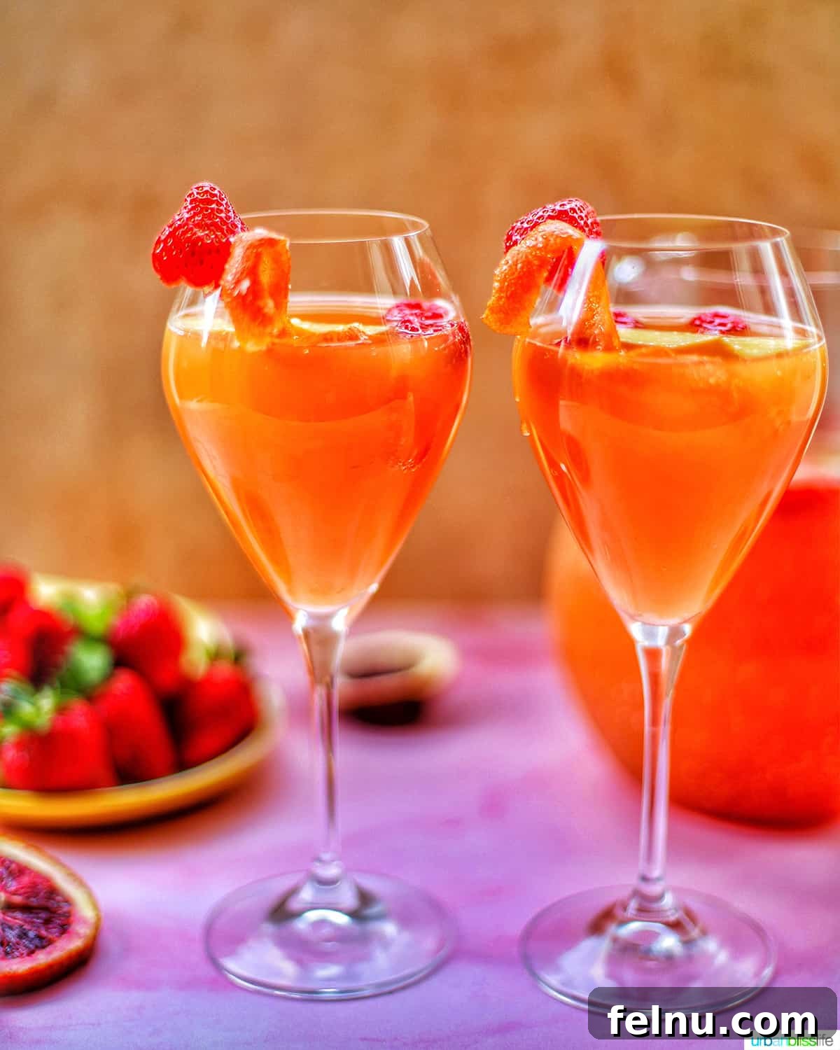 Tropical Sangria Bliss 2 Two glasses of tropical sangria with raspberries and citrus
