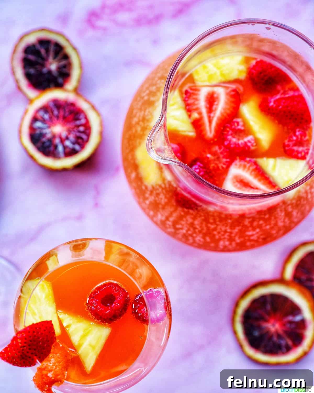 Tropical Sangria Bliss 4 Pitcher and glass of tropical sangria