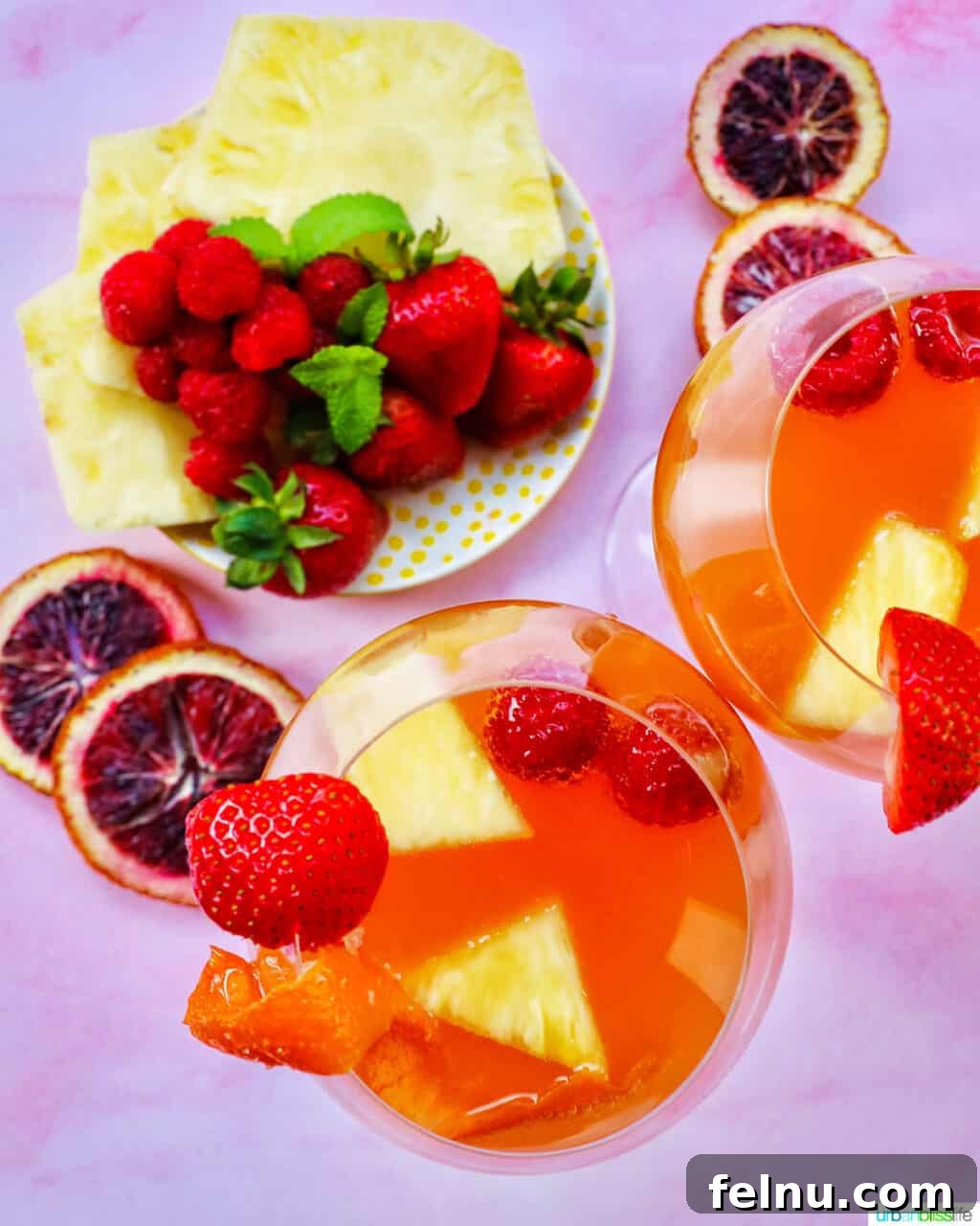 Tropical Sangria Bliss 5 Sliced fruit with glasses of tropical sangria