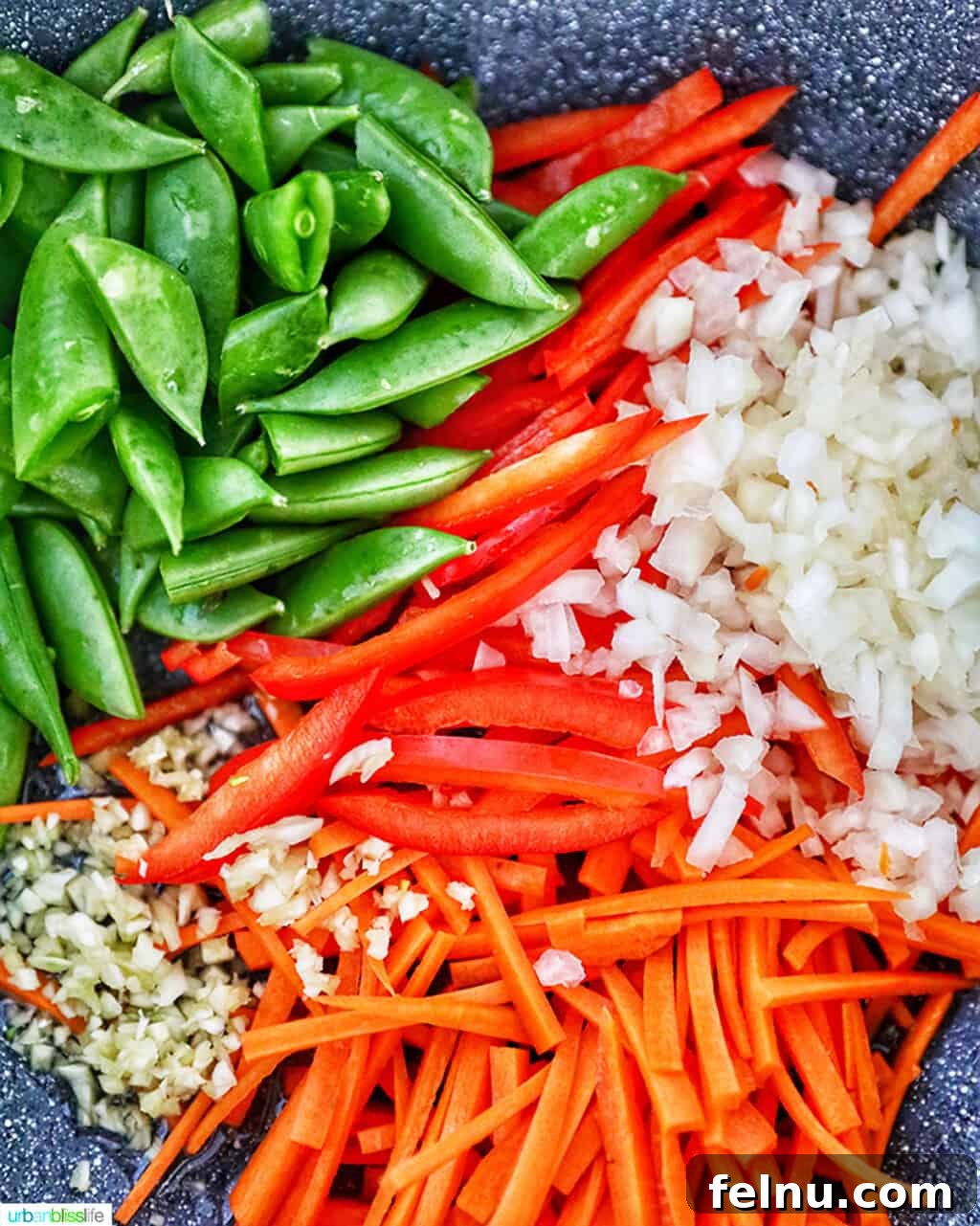 Filipino Pancit Bihon Delight 9 Stir-fried vegetables for Filipino Pancit Bihon in a wok.