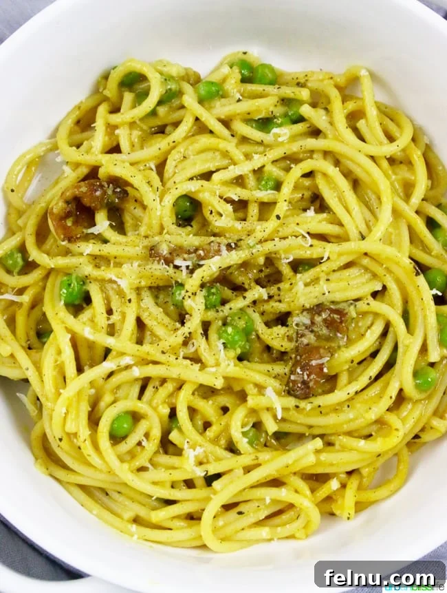 Costco's Complete Monthly Meal Solution 30 Pasta with Turmeric, Bacon, and Peas is a hearty lunch or dinner dish full of flavor! Recipe on UrbanBlissLife.com