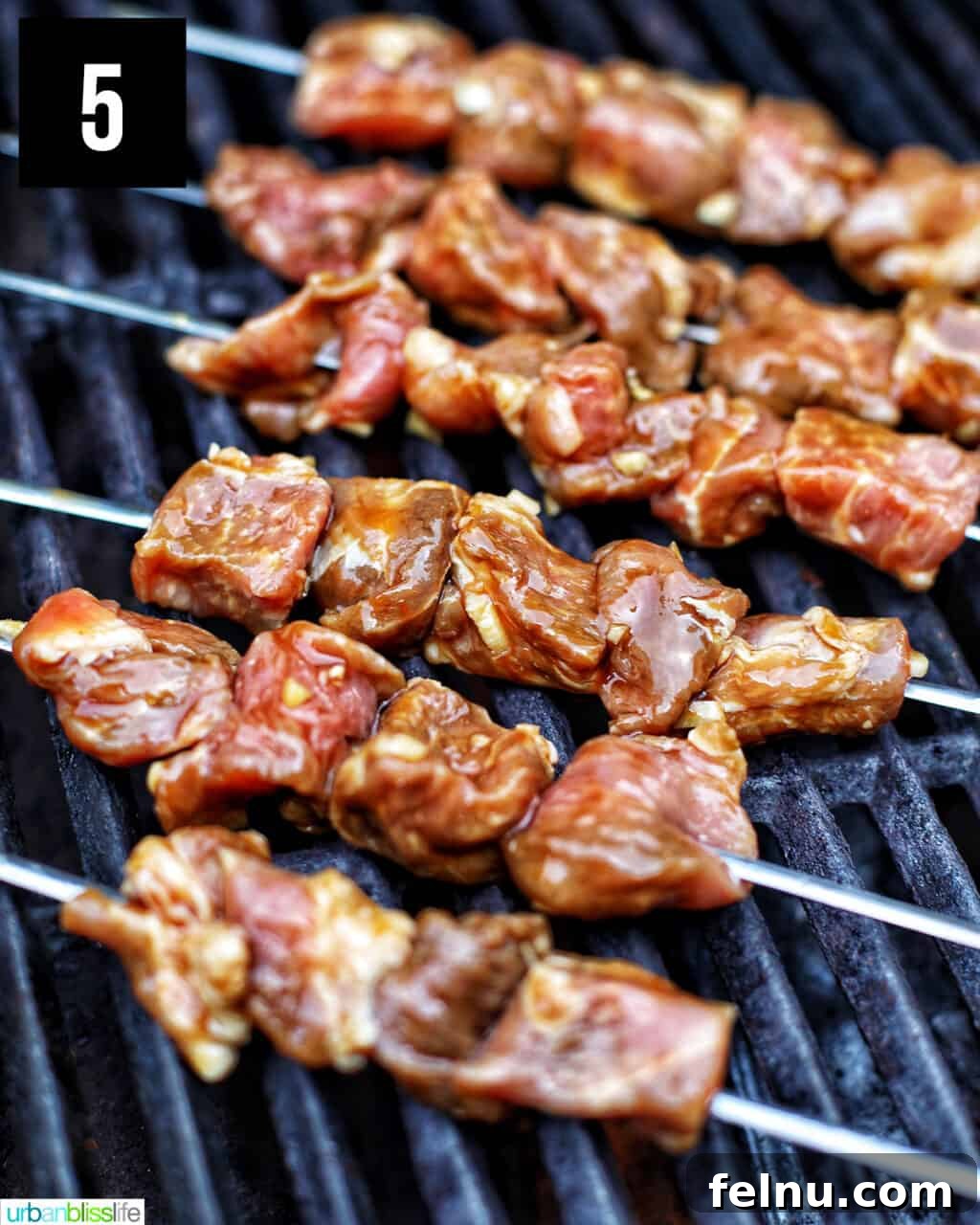 Filipino-Style Grilled Pork Skewers 10 Filipino BBQ pork skewers on the grill