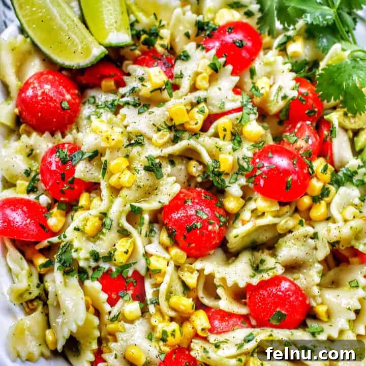 Close-up of Avocado Pasta Salad with Tomato and Corn.