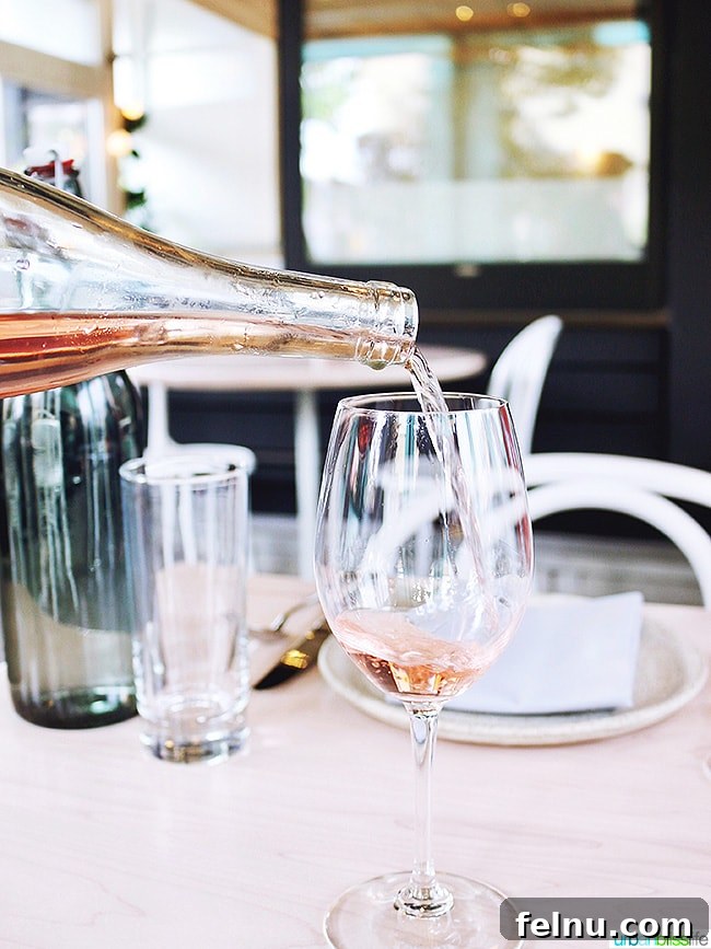 Rosé wine pouring at Tusk weekend happy hour