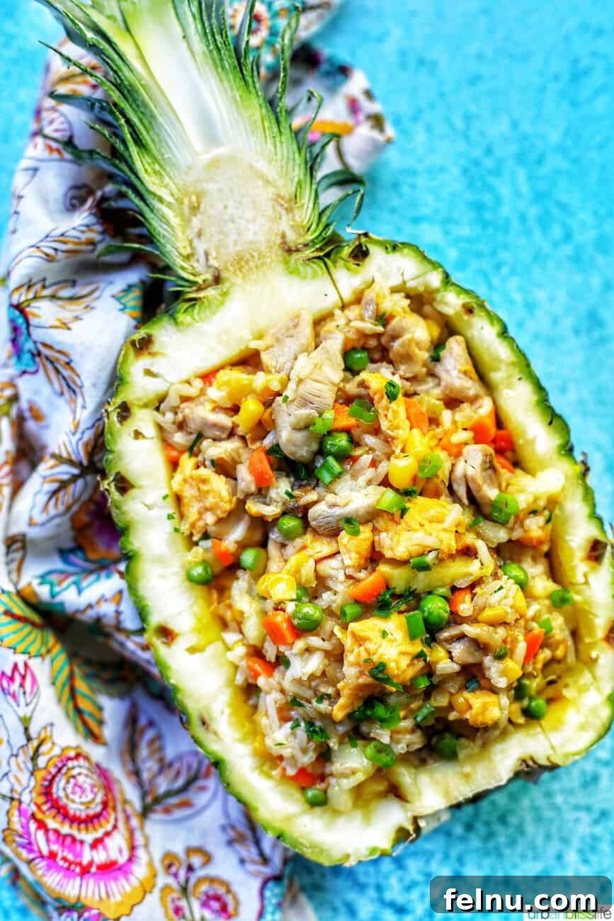 Pineapple Paradise Chicken Fried Rice 2 chicken pineapple fried rice in hollowed out pineapple boat