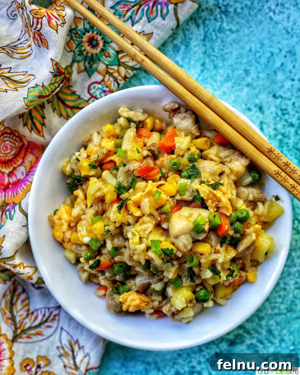 Pineapple Paradise Chicken Fried Rice 18 bowl of pineapple fried rice with chopsticks