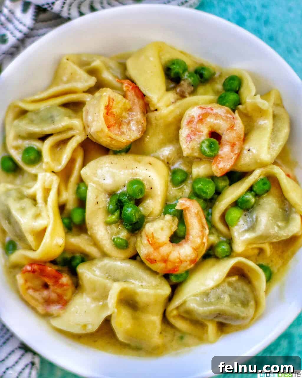 Savory Shrimp & Tortellini Dairy-Free Delight 2 Dairy-Free Shrimp Tortellini with Peas in a bowl
