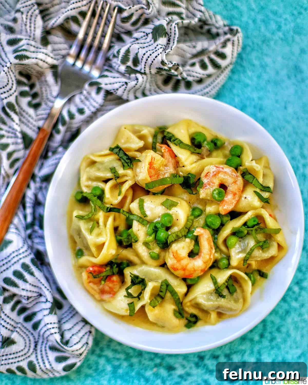 Savory Shrimp & Tortellini Dairy-Free Delight 13 Dairy-Free Shrimp Tortellini with Peas in a bowl