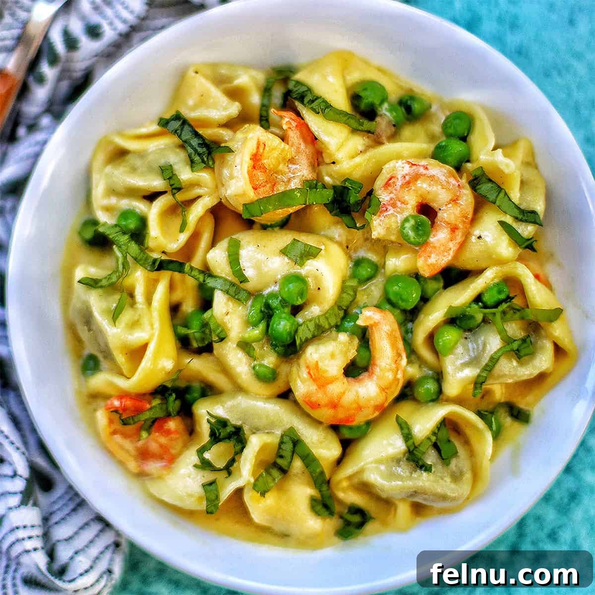 Savory Shrimp & Tortellini Dairy-Free Delight 14 Dairy-Free Shrimp Tortellini with Peas in a bowl