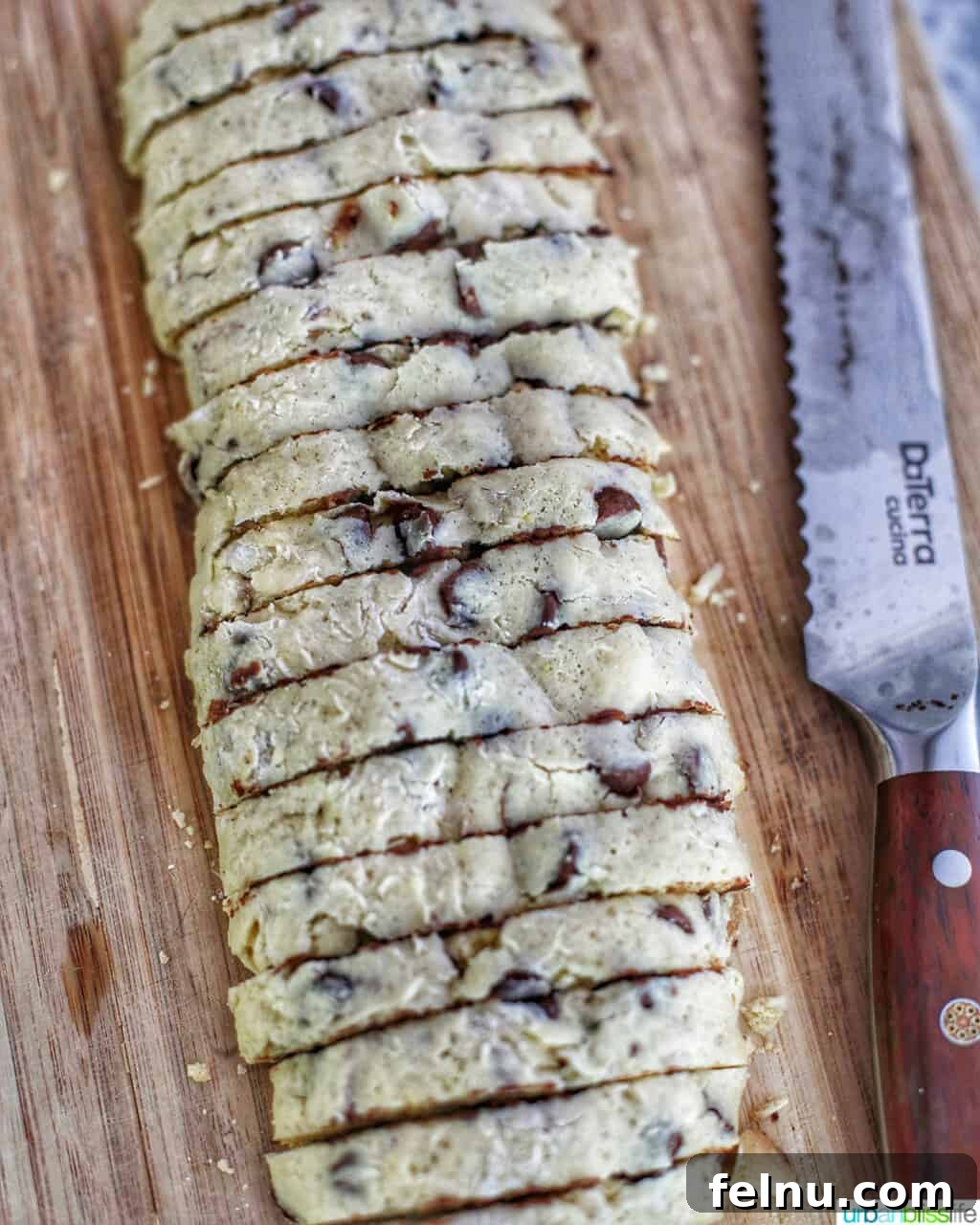 Toasted Almond Chocolate Chip Biscotti 12 slicing chocolate chip almond biscotti logs into individual cookies
