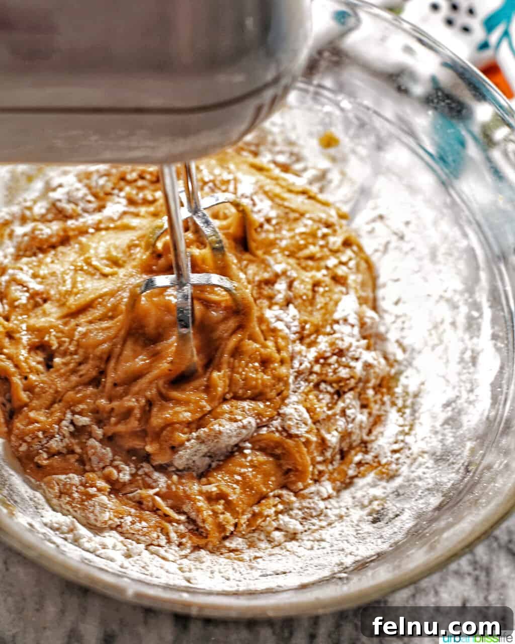 Golden Brown Butter Espresso Chocolate Chip Cookies 8 Adding dry ingredients to wet ingredients in a mixer