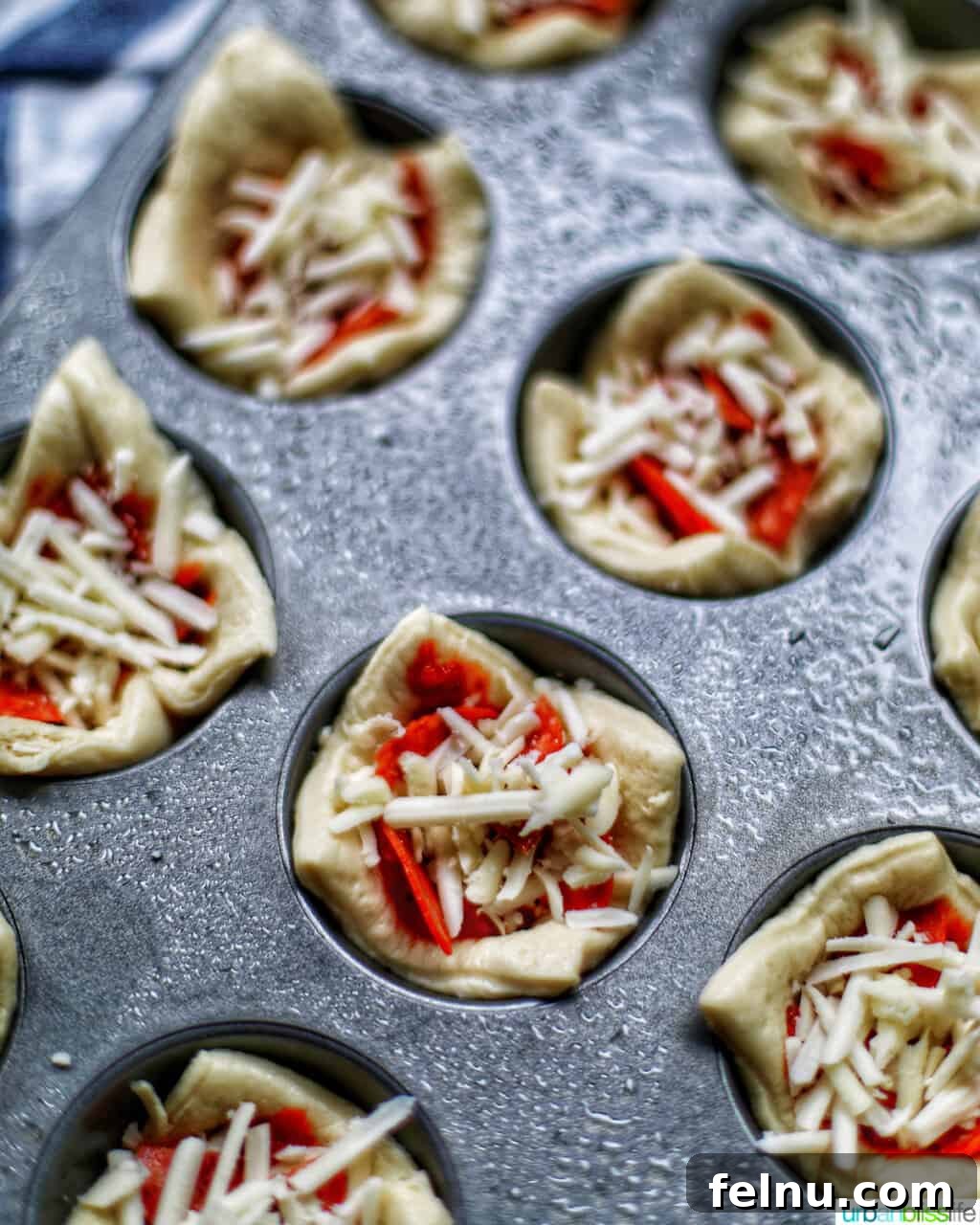 Effortless Pizza Bites 8 Pizza Cups in Muffin Tins Ready to Go into the Oven