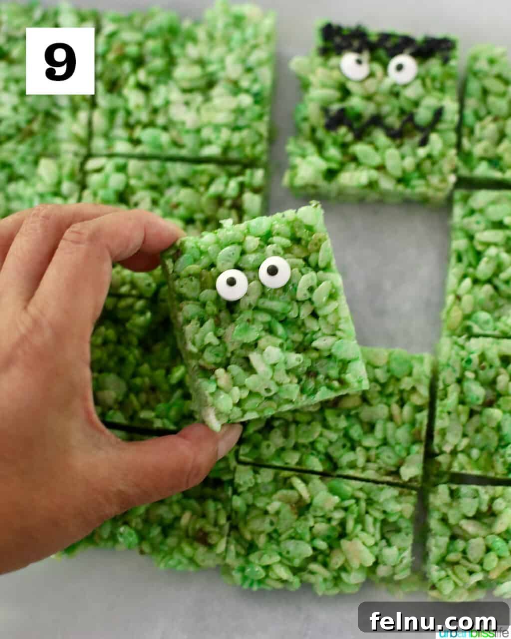 Frankenstein's Monster Munch 13 A green Rice Krispie treat with two candy eyeballs attached, ready for further decoration.