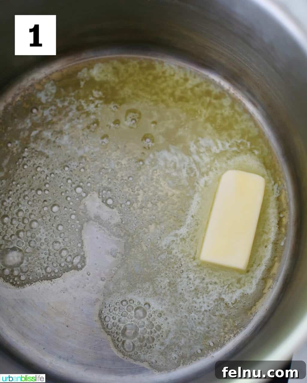 Frankenstein's Monster Munch 5 Close-up of butter melting in a large pot over medium heat, forming a clear golden liquid.