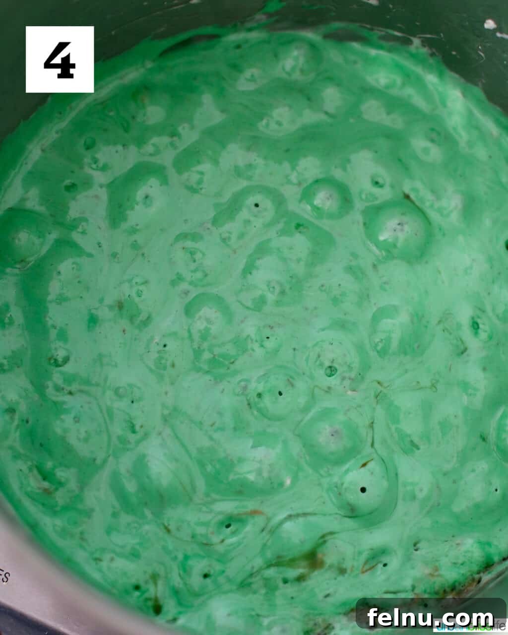 Frankenstein's Monster Munch 8 The marshmallow mixture fully tinted bright green, having been thoroughly mixed with food coloring.