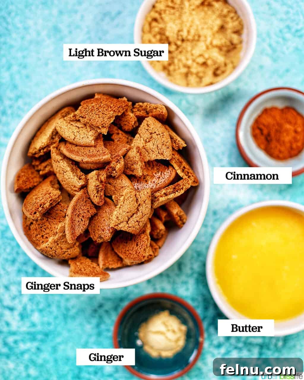 Autumn Spice Cheesecake Squares 5 Ingredients for the Gingersnap Crust: gingersnap cookies, brown sugar, ginger, cinnamon, and melted butter.