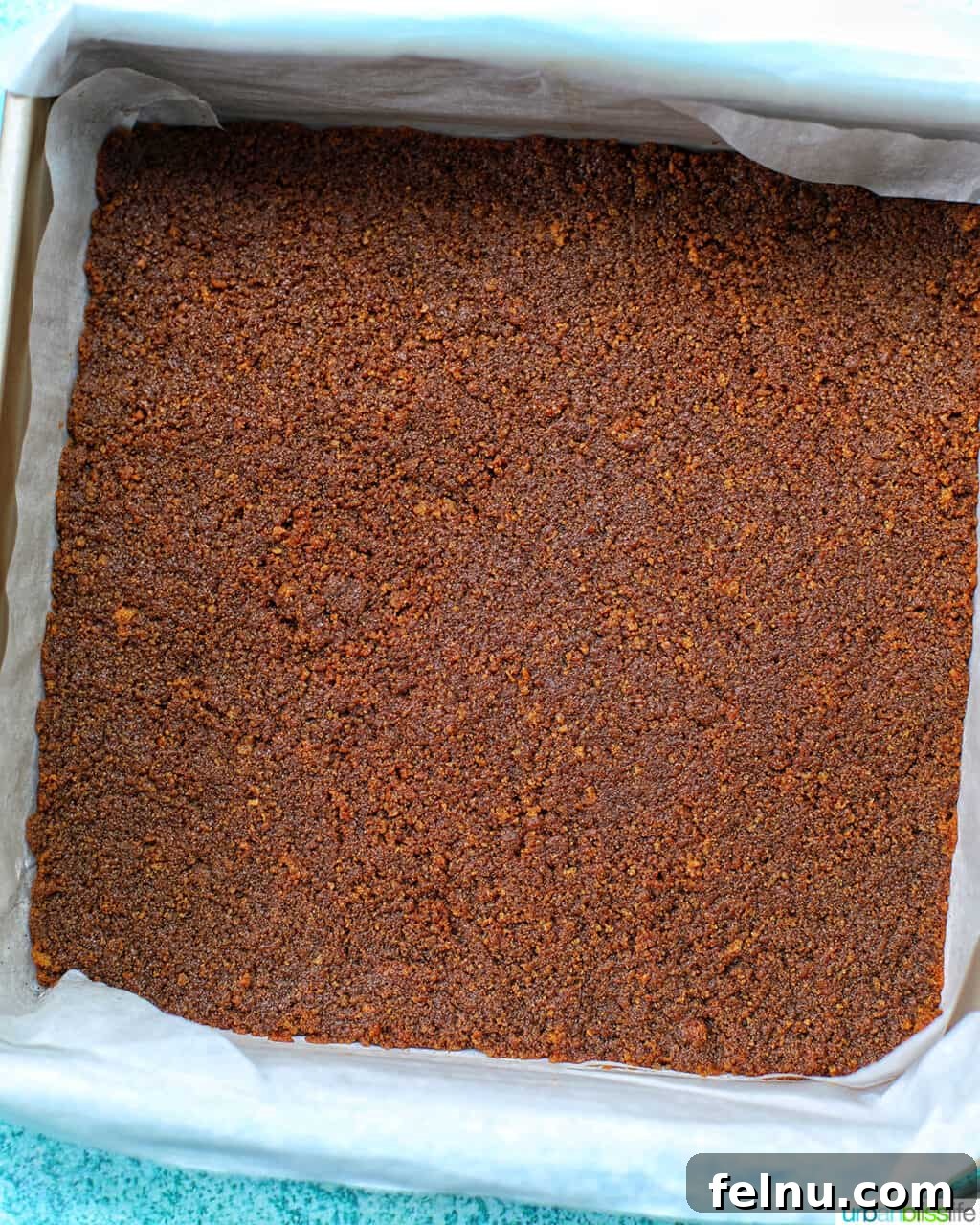 Autumn Spice Cheesecake Squares 10 Gingersnap crust pressed into the baking pan.