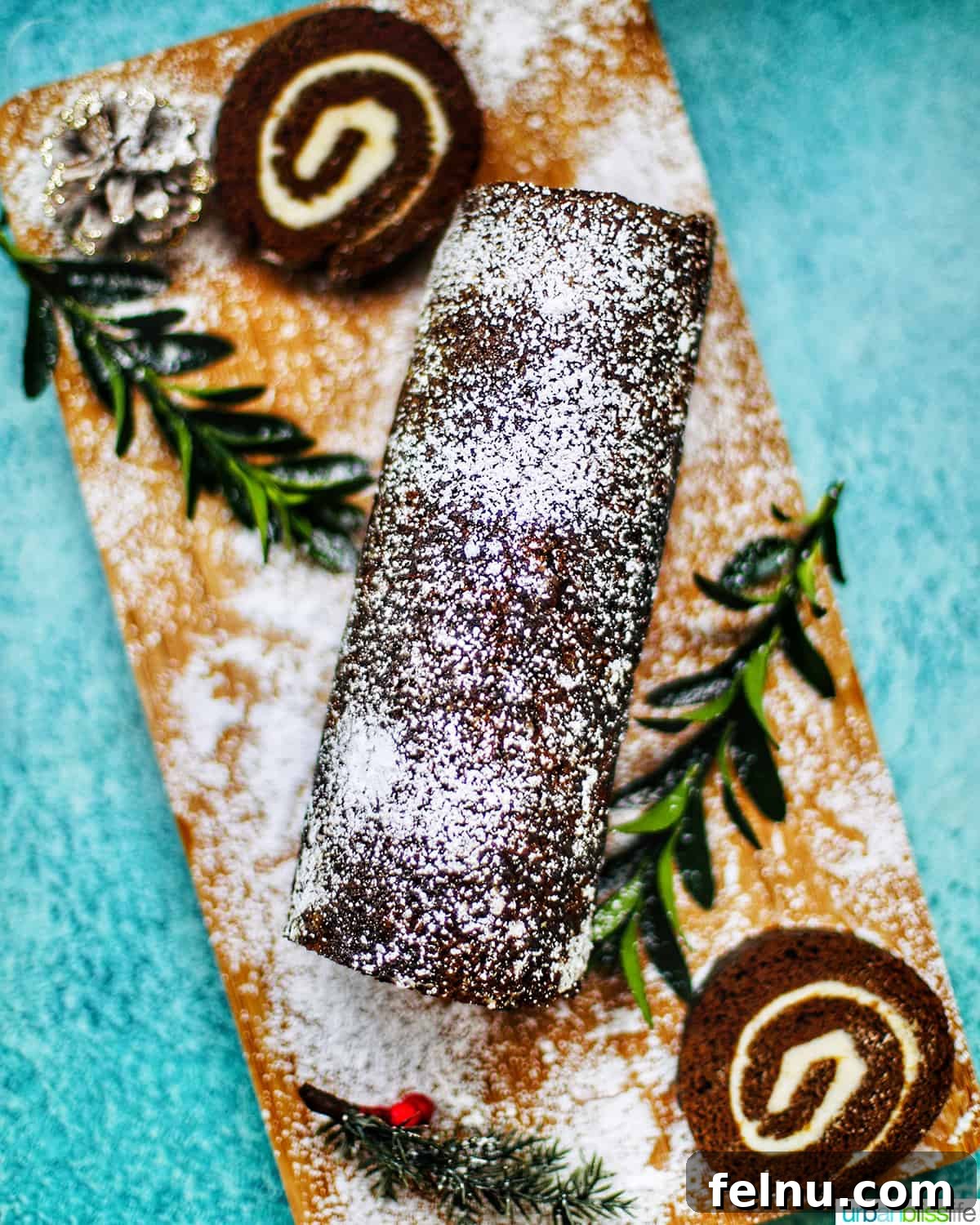 Gingerbread Swirl Cake 20 Gingerbread cake roll with holiday trimmings and cream cheese filling, surrounded by Christmas decorations.