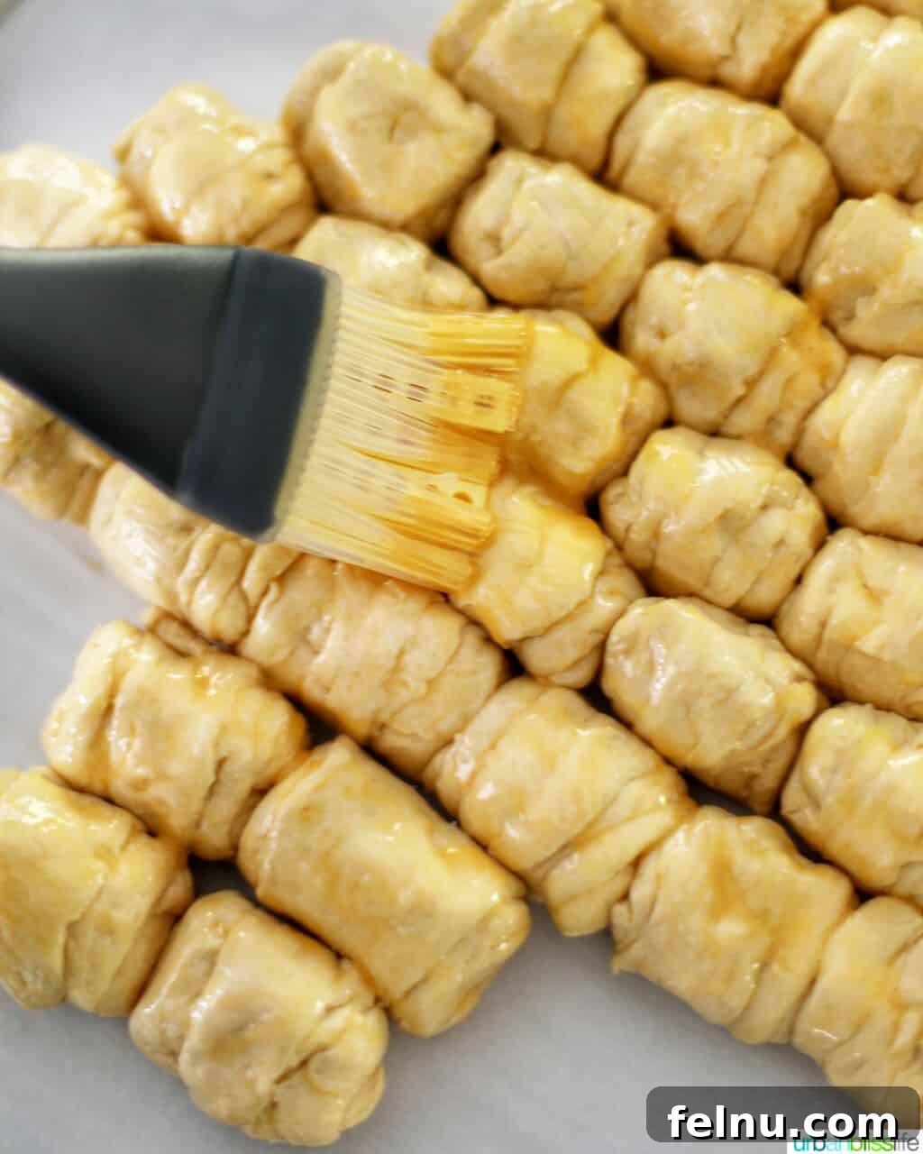 Christmas Tree Pull-Apart Bread
Festive Christmas Tree Bread 13 brushing egg wash onto dough