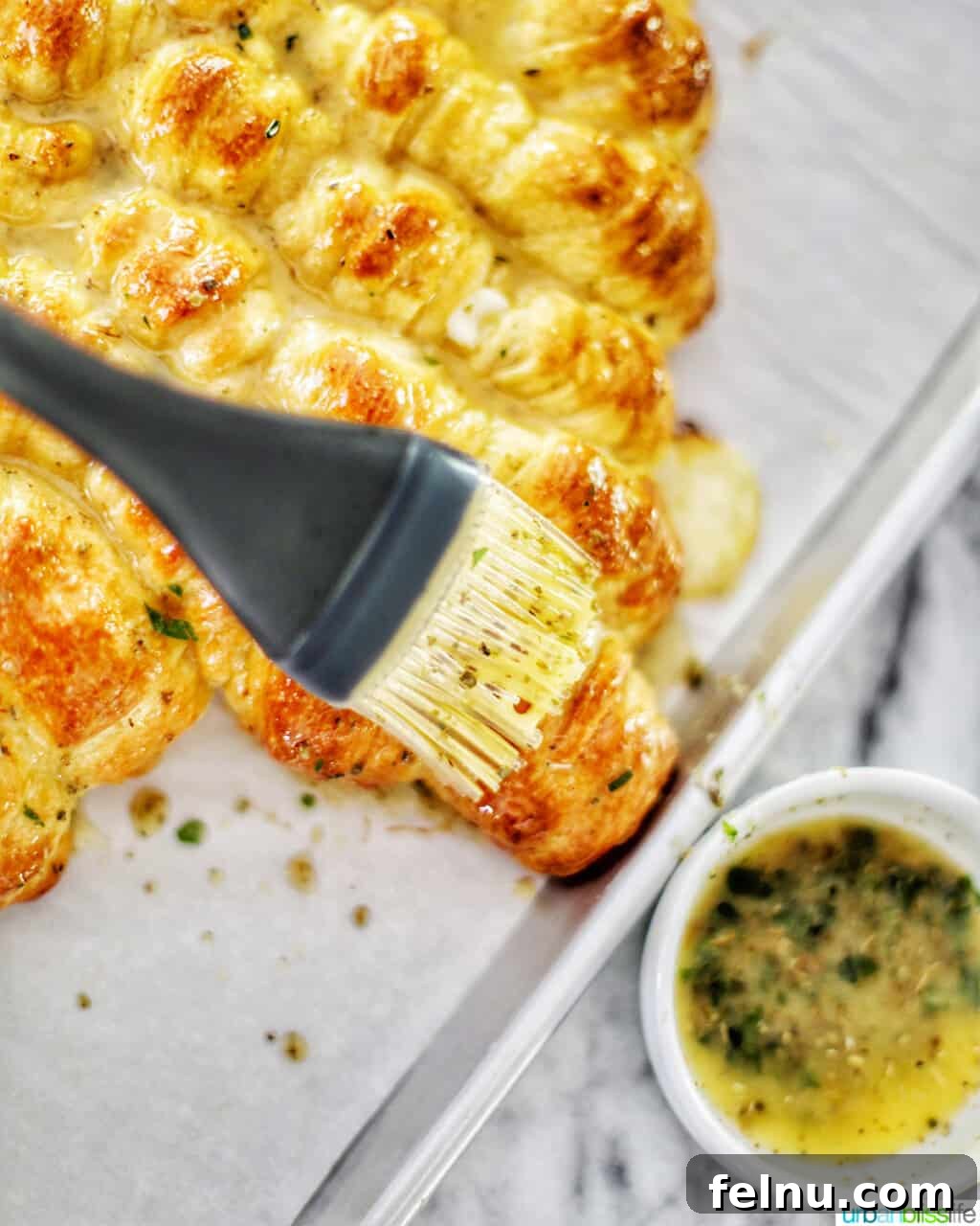 Christmas Tree Pull-Apart Bread
Festive Christmas Tree Bread 15 brushing butter herb mix onto dough