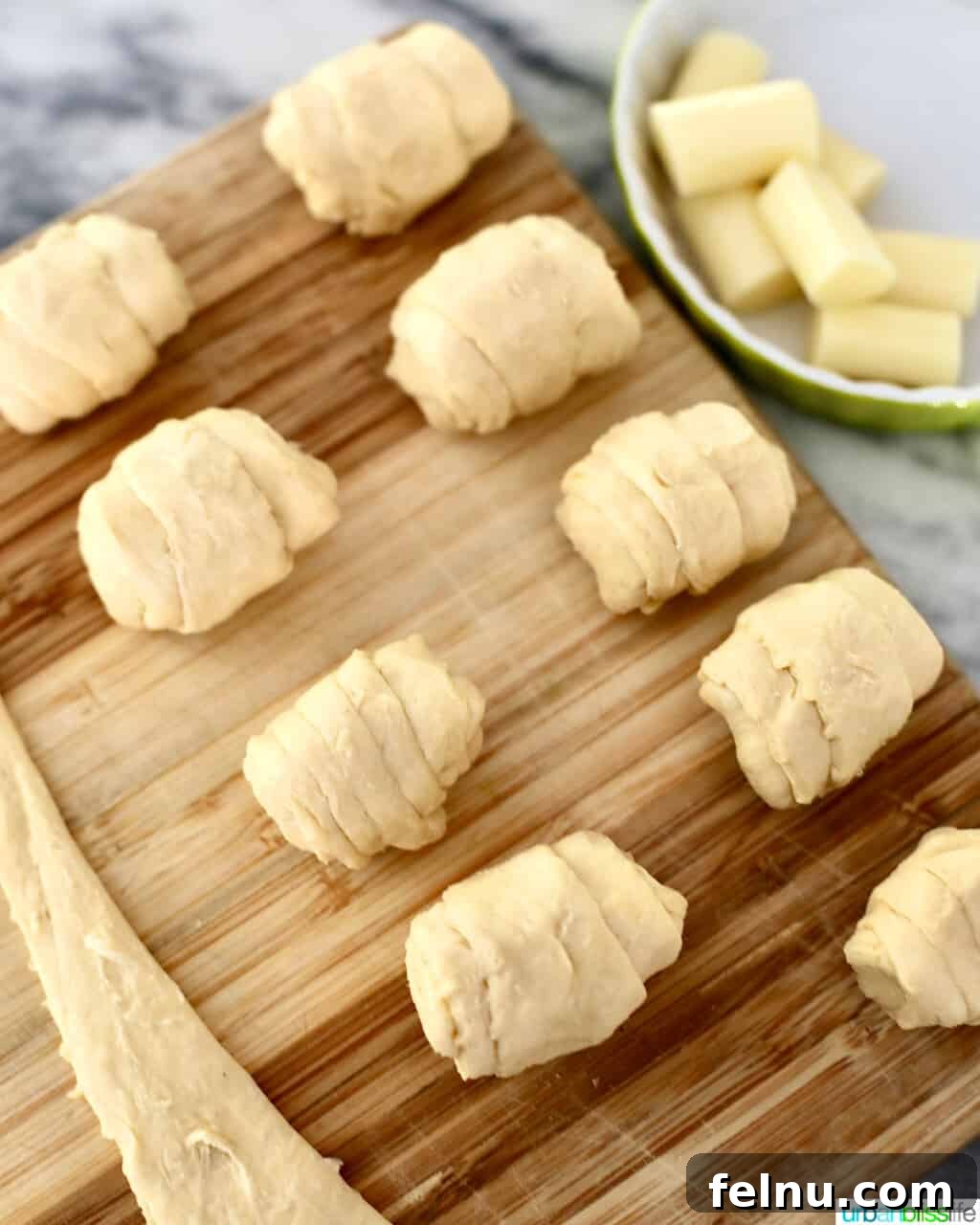 Christmas Tree Pull-Apart Bread
Festive Christmas Tree Bread 10 angled image of rolled up cheese-stuffed dough
