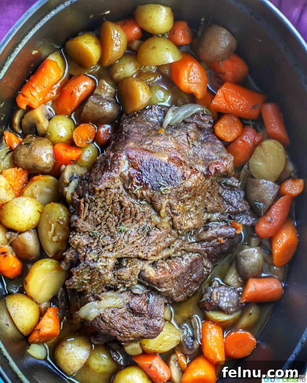 Succulent Dutch Oven Pot Roast 11 Cooked pot roast with veggies in a dutch oven