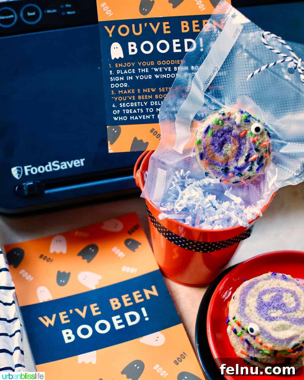 Sealed Halloween pinwheel cookies packaged with 'You've Been Booed' cards, ready for a delightful surprise delivery.
