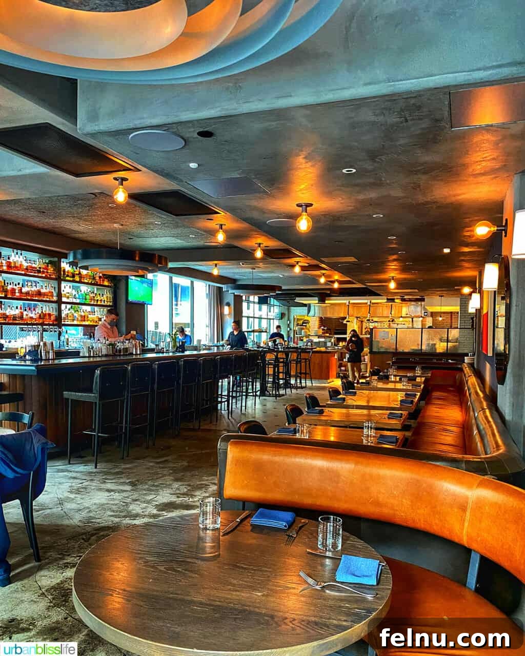 The Bullard Arms 2 The inviting and stylish dining room of Bullard Tavern in downtown Portland, featuring dark wood, comfortable leather seating, and warm lighting, ready to welcome guests.