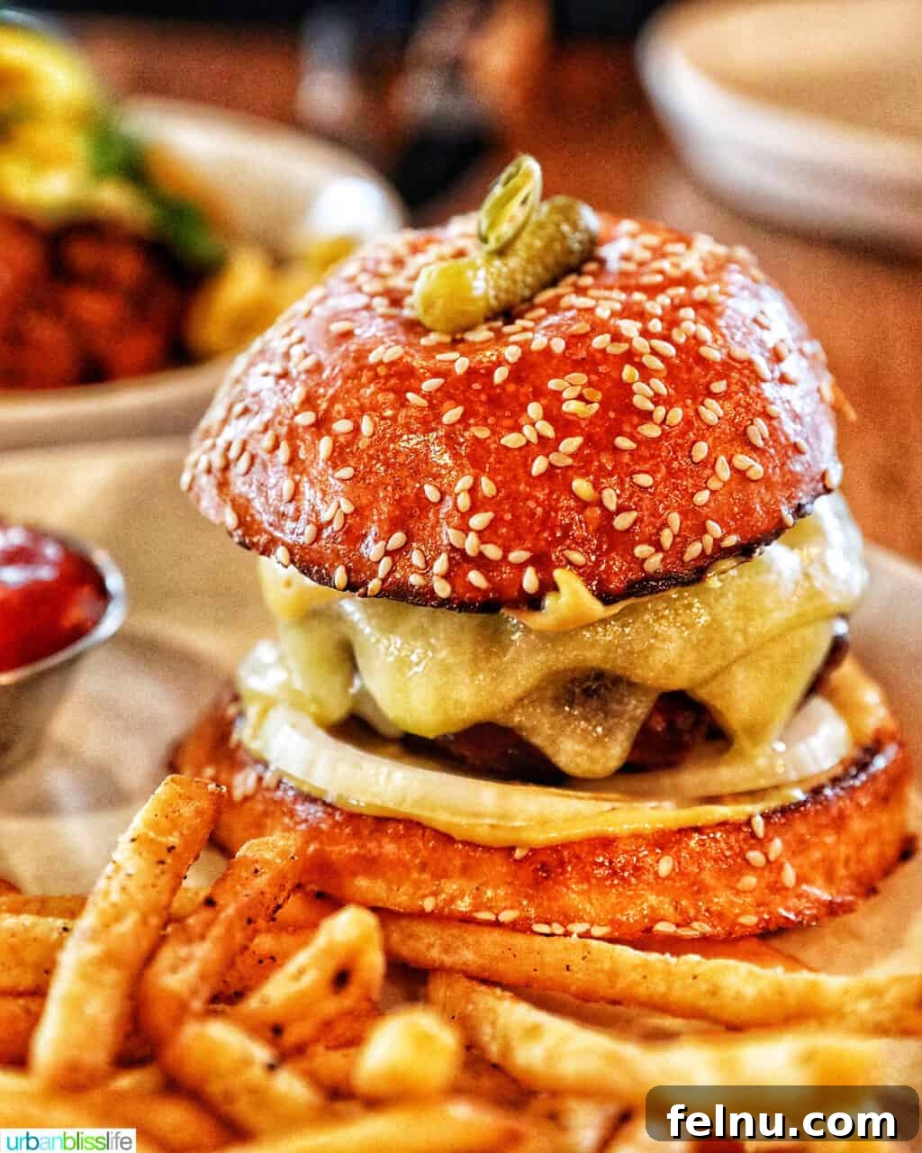 The Bullard Arms 8 The iconic Bullard Burger, served with a generous side of golden, crispy fries, a testament to quality ingredients and expert preparation at Bullard Tavern.