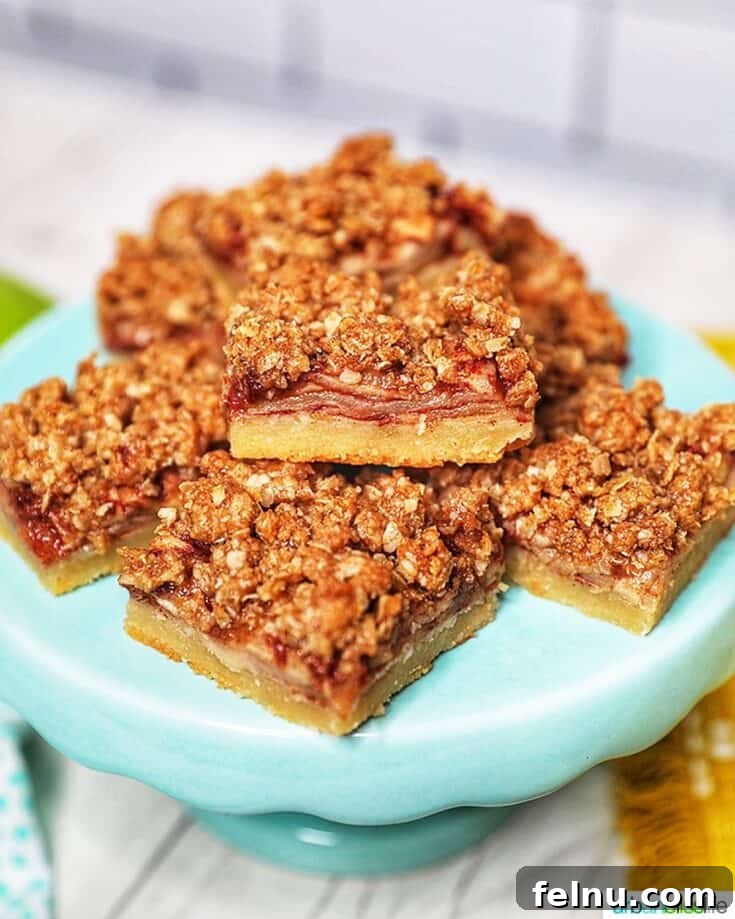Stacked Apple Pie Bars with a crumbly topping.